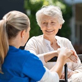 Nurse attending a patient in long-term-care