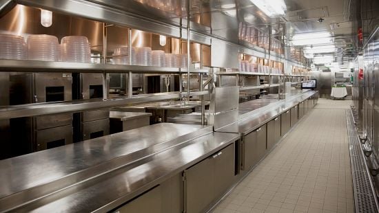 Full length picture of a clean commercial restaurant kitchen.